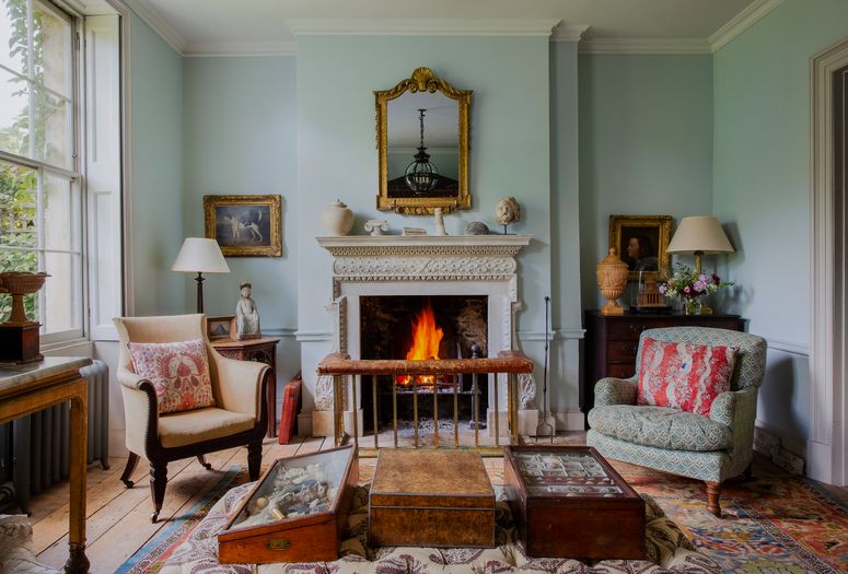 Image may contain: Living Room, Room, Indoors, Furniture, Hearth, Couch, Fireplace, Interior Design, and Home Decor