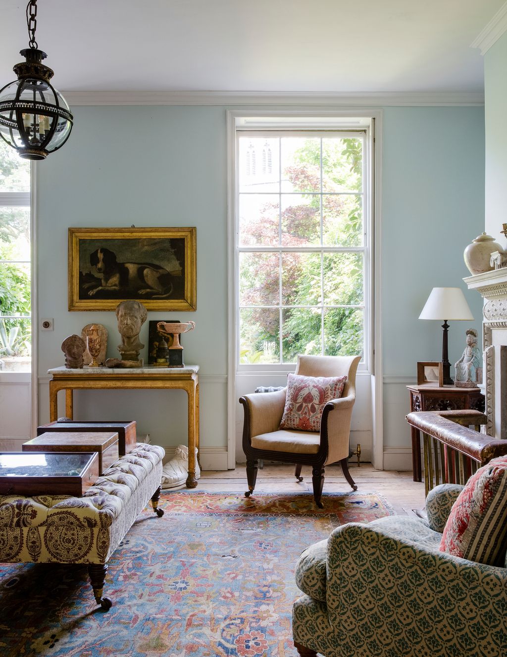 Image may contain Living Room Indoors Room Furniture Couch Interior Design Rug Human and Person