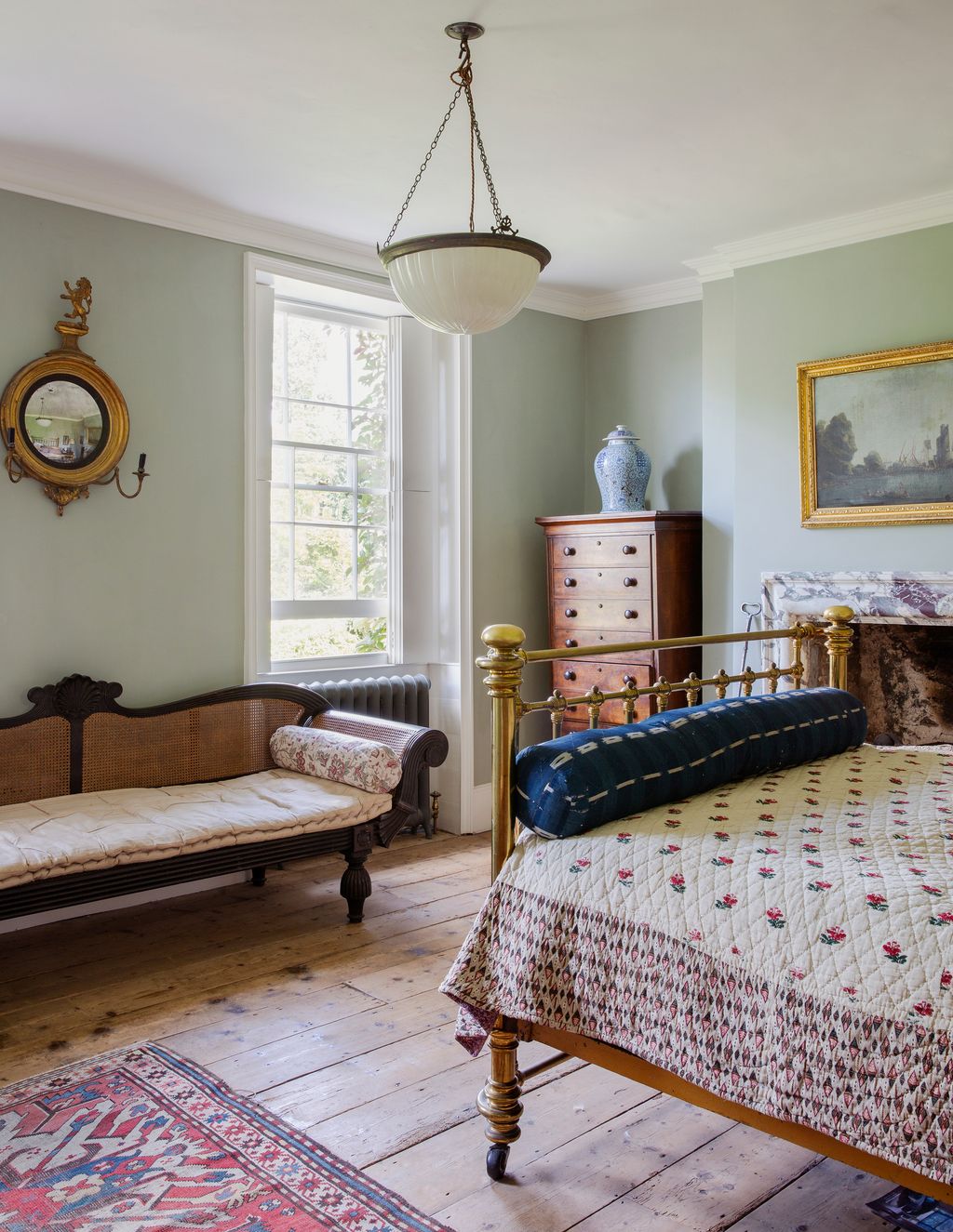 Image may contain Furniture Room Indoors Living Room Bedroom Interior Design Wood Hardwood Bed and Flooring