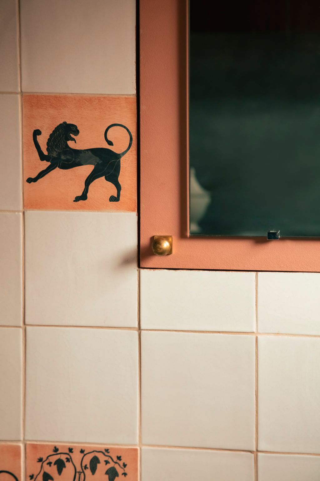 The terracotta lion tile and the others like it in the bathroom are from the Greek Figures series handmade by Douglas...