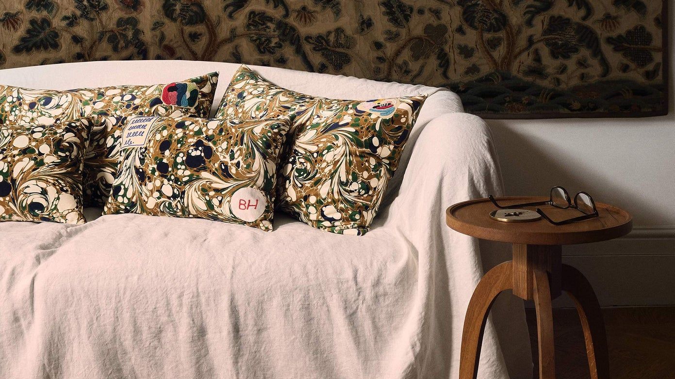 Image may contain Couch Furniture Cushion Living Room Indoors Room and Home Decor