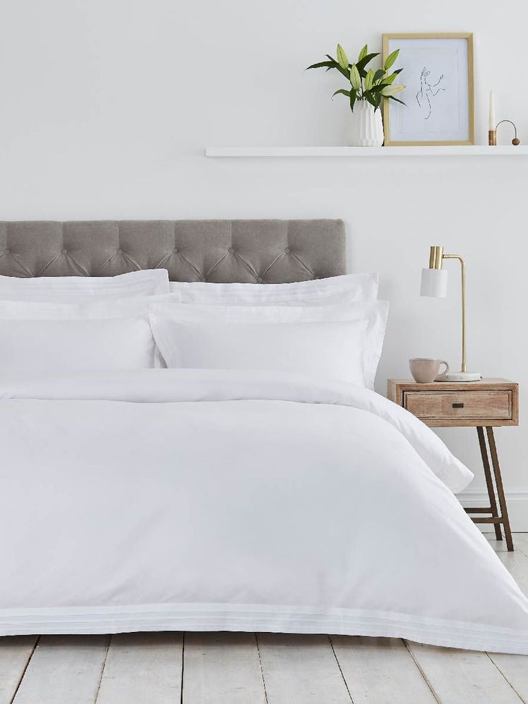 Image may contain: Home Decor, Furniture, Interior Design, Indoors, Cushion, Pillow, Bed, Room, Bedroom, Blanket, and Linen