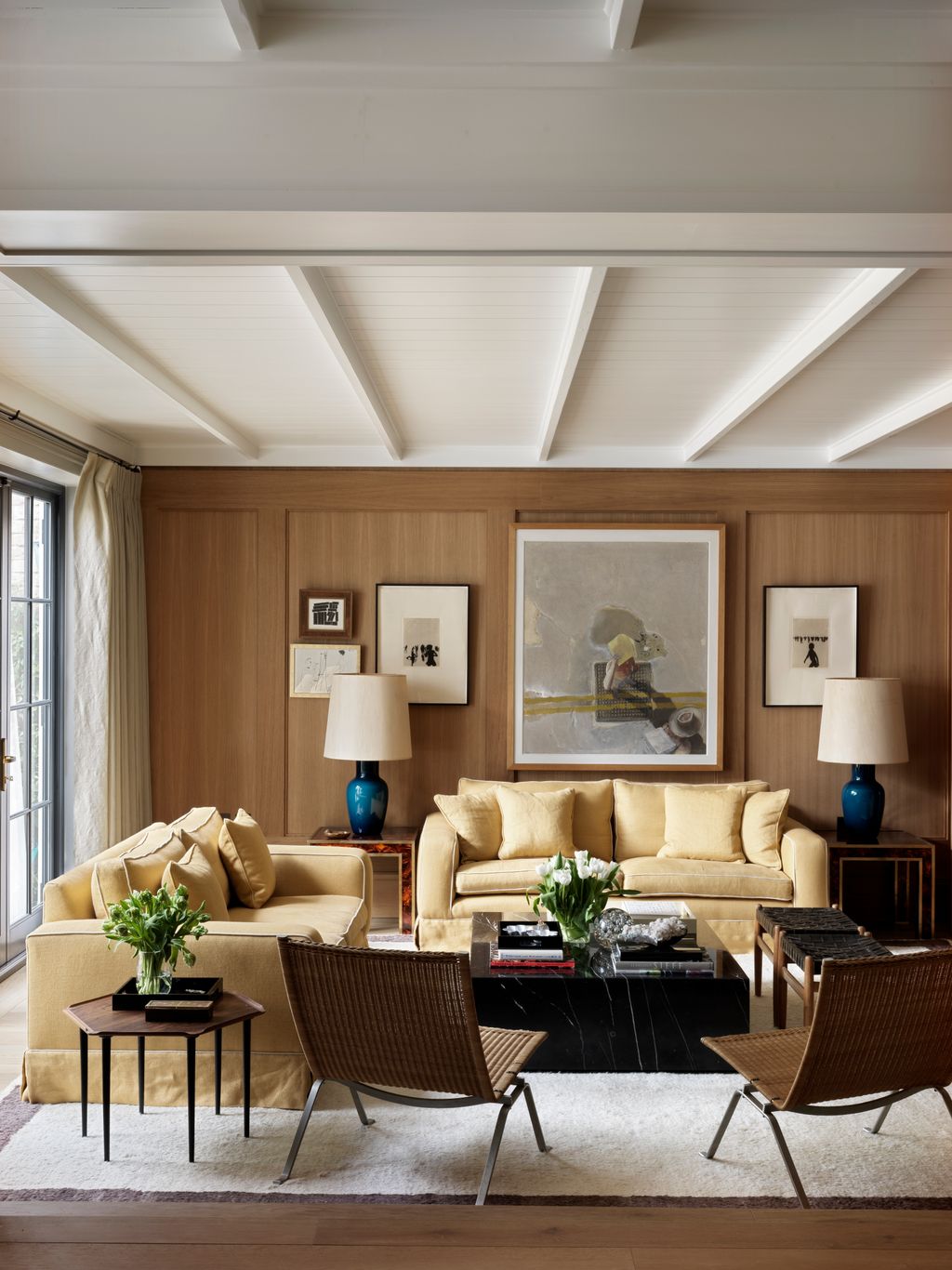 Image may contain Furniture Living Room Room Indoors Couch Table Coffee Table Chair Rug and Lobby