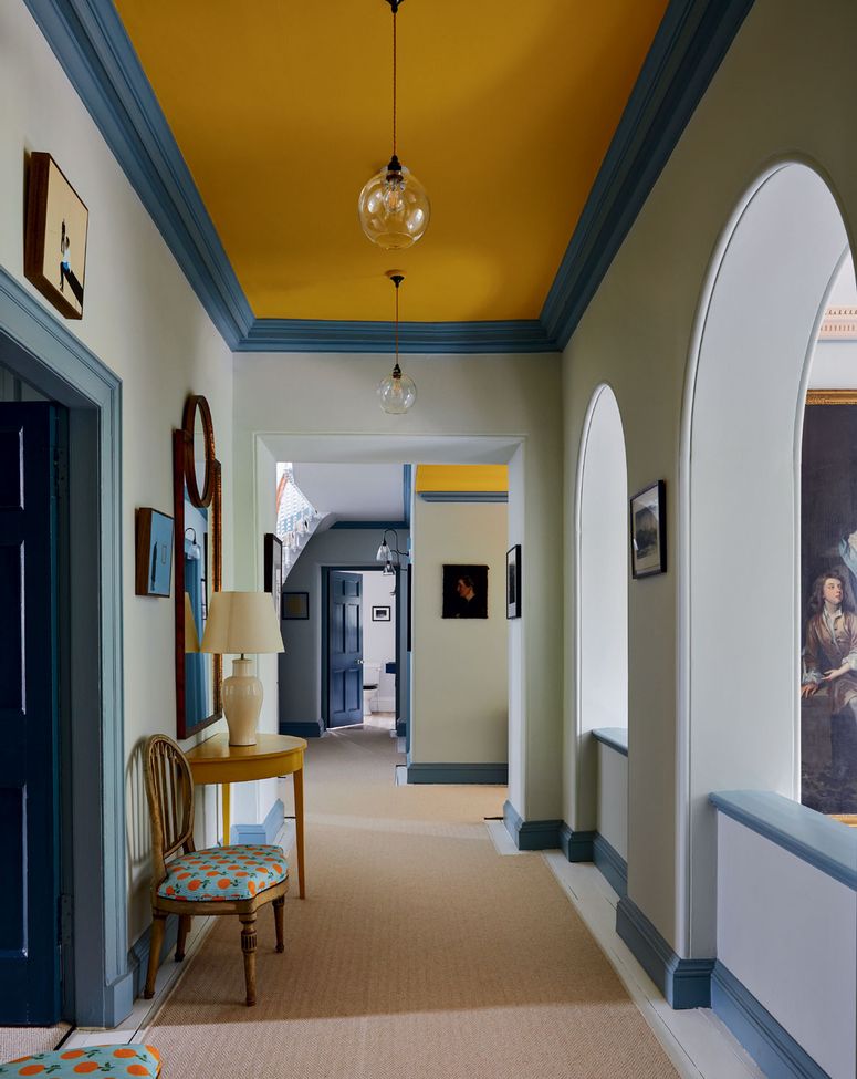 Image may contain: Flooring, Human, Person, Floor, Corridor, Furniture, Chair, Interior Design, and Indoors