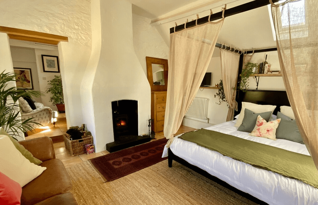 Image may contain Flooring Furniture Bed Wood Hardwood Indoors Floor Interior Design Room Bedroom and Hearth