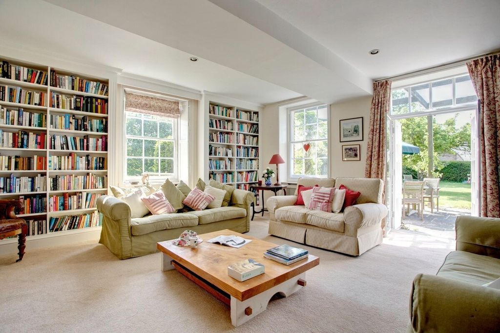 Image may contain Furniture Couch Table Living Room Room Indoors Coffee Table Rug Interior Design and Book