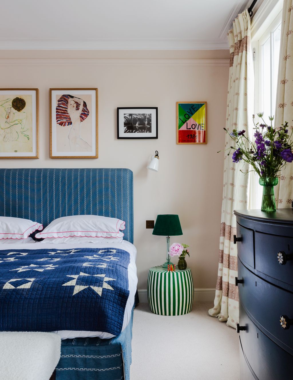 Image may contain Room Bedroom Indoors Furniture Interior Design Bed Plant Flower and Blossom