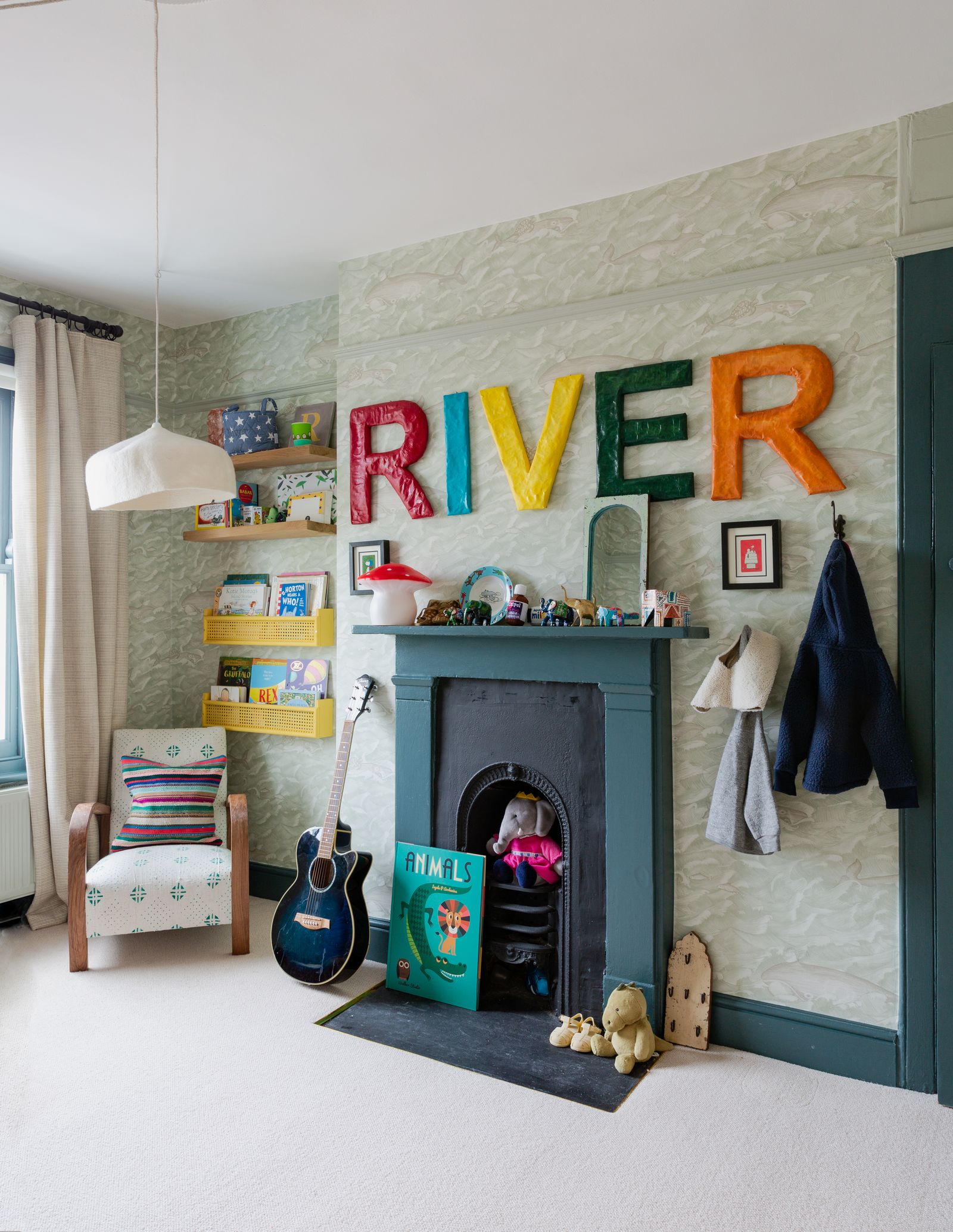 Image may contain Interior Design Indoors Furniture Room Corner Living Room Musical Instrument and Guitar