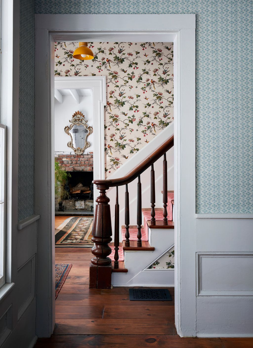 Image may contain Flooring Floor Banister Handrail Wood Hardwood Interior Design Indoors and Staircase