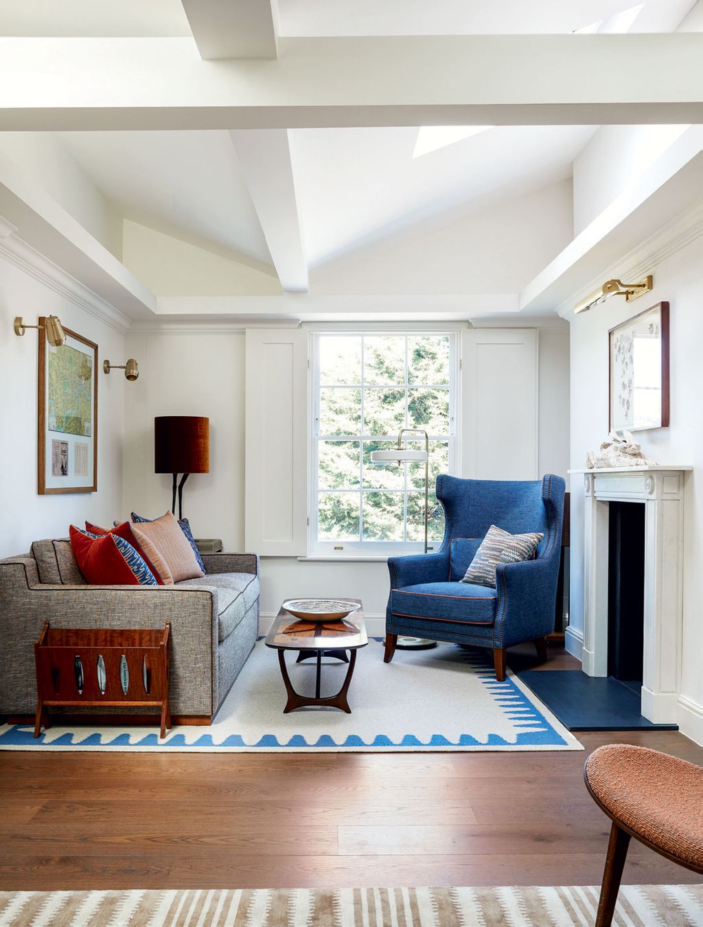 Image may contain Furniture Table Living Room Indoors Room Couch Rug and Coffee Table