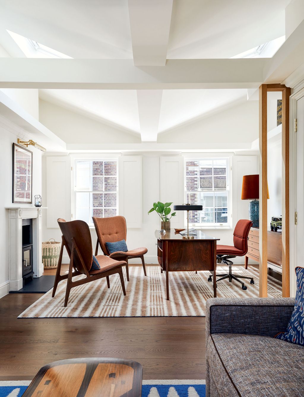 Image may contain Furniture Chair Living Room Room Indoors Interior Design Table Flooring Tabletop Floor and Rug