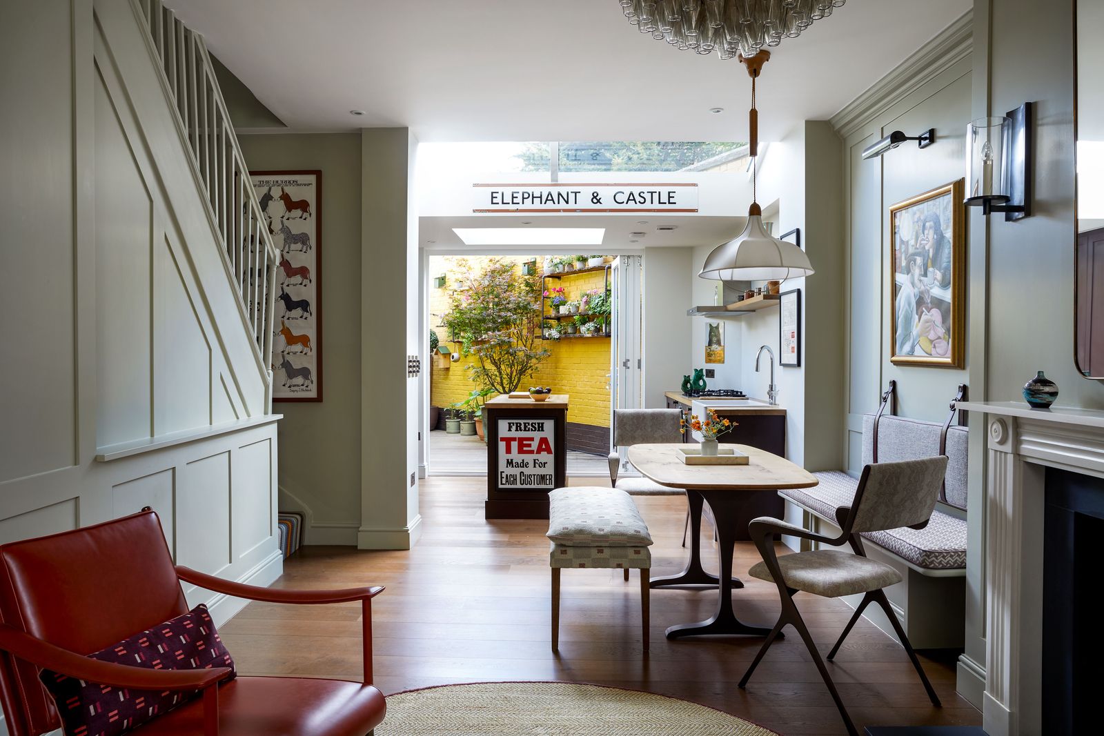 Image may contain Furniture Interior Design Indoors Table Living Room Room Chair Wood Flooring and Coffee Table