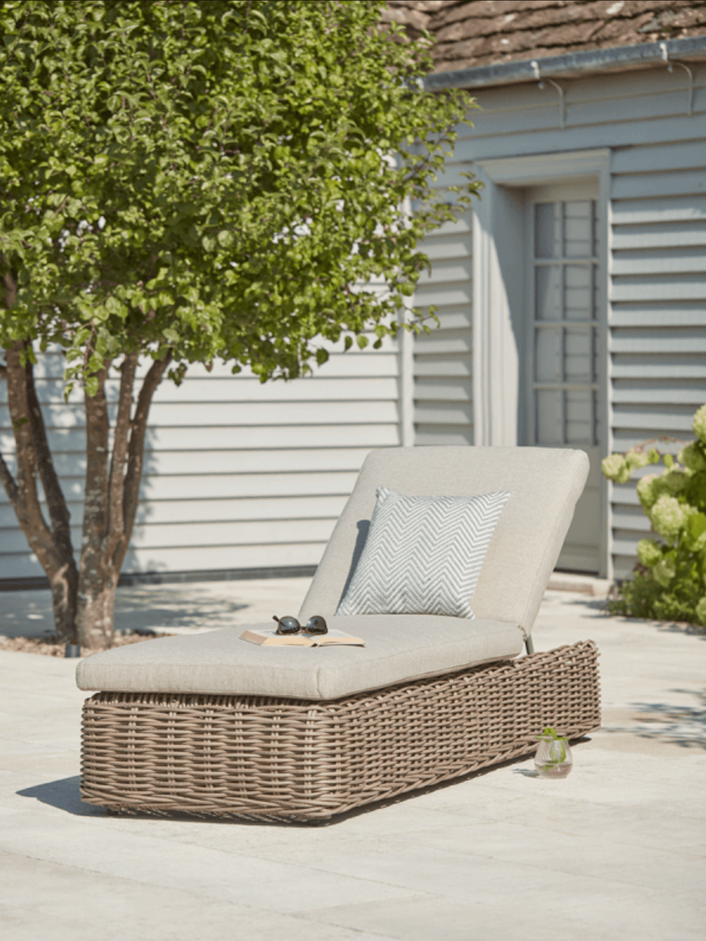 Image may contain Furniture Cushion Pillow Patio Home Decor Bush Vegetation Plant and Porch