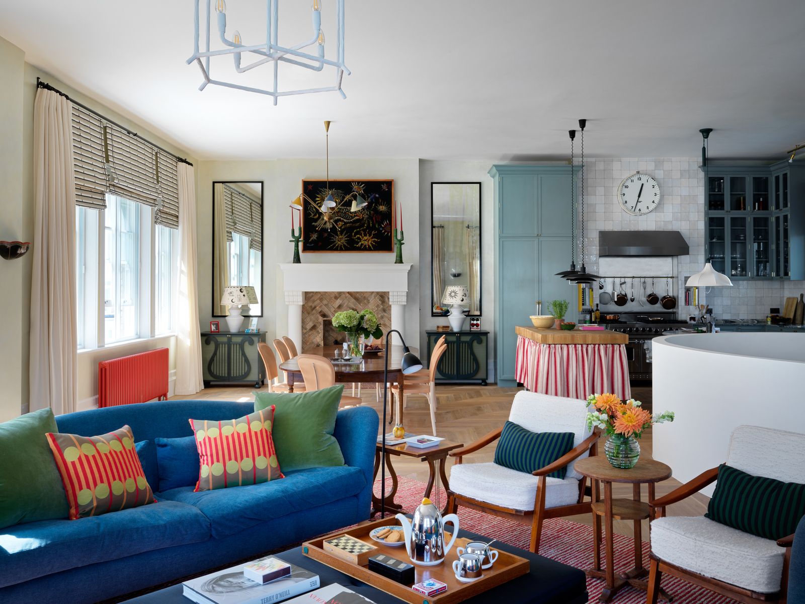 Image may contain Living Room Room Indoors Furniture Couch Table Coffee Table Interior Design and Clock Tower