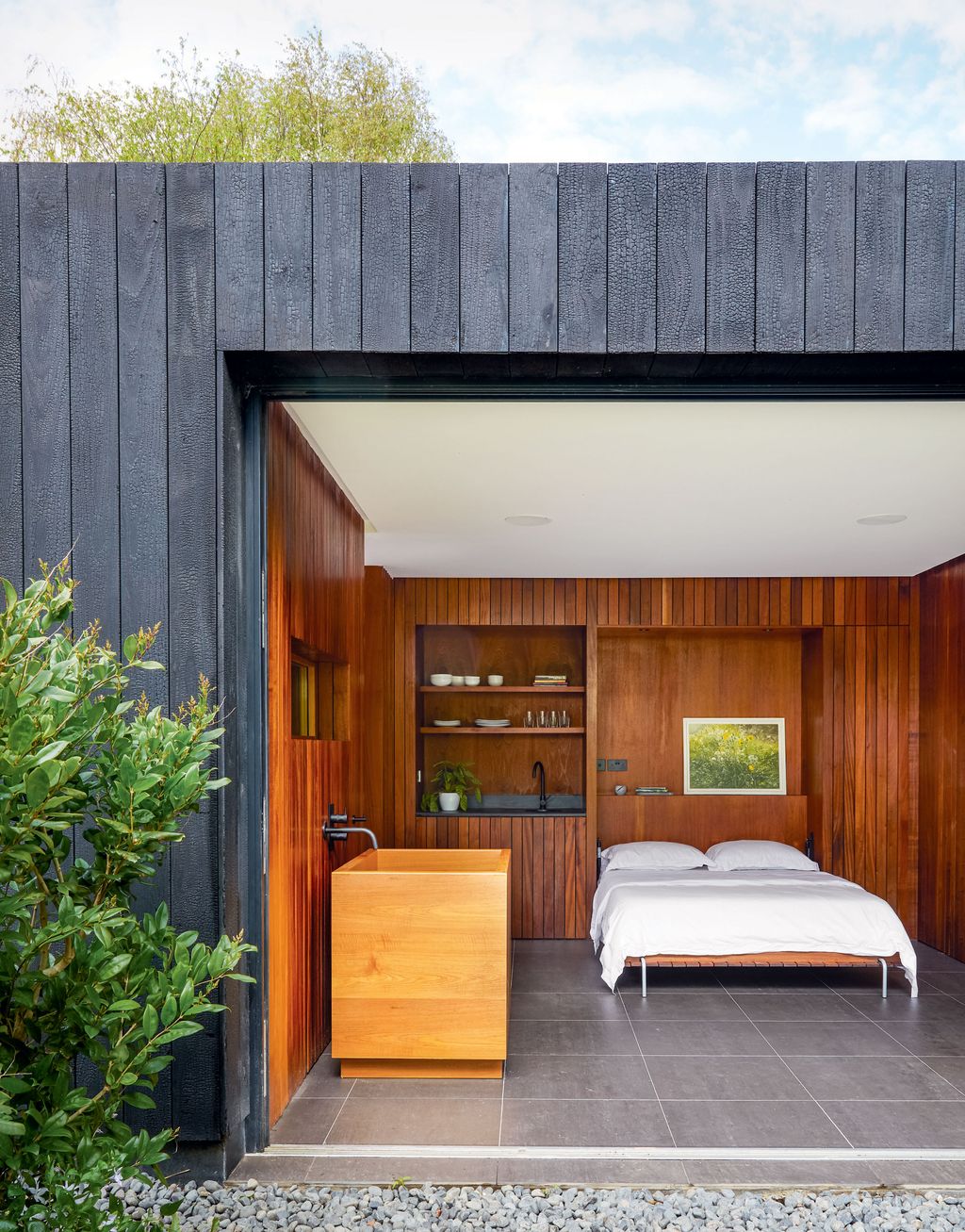 Image may contain Wood Furniture Housing Building Hardwood Room Bedroom Indoors Plywood and Interior Design