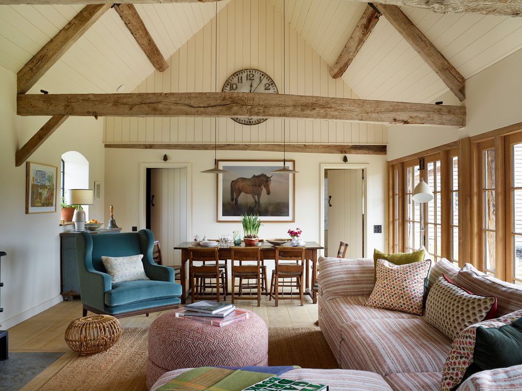 Image may contain Living Room Room Indoors Furniture Couch Interior Design Chair Wood Flooring Table and Hardwood