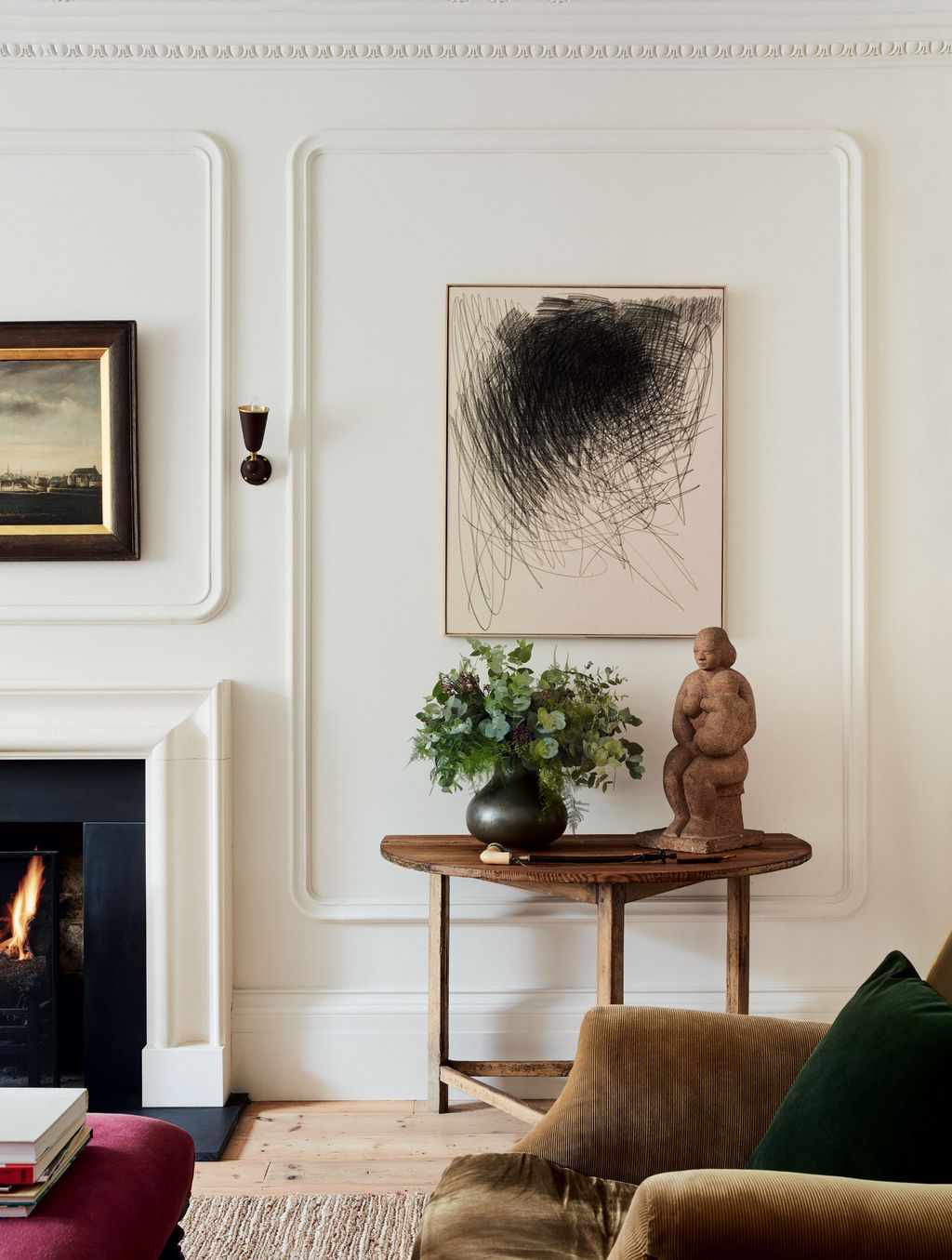 Image may contain Fireplace Indoors Hearth Furniture Living Room Room and Interior Design