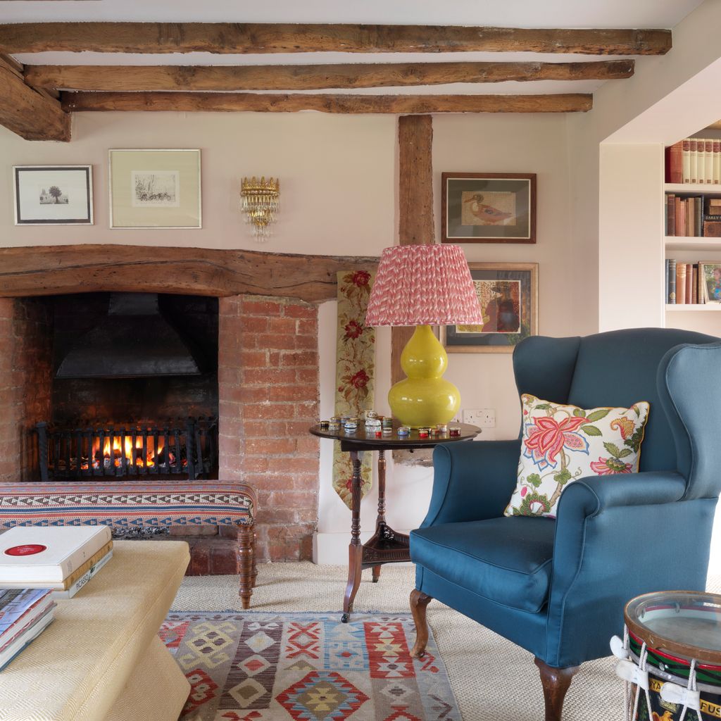 Image may contain Furniture Living Room Room Indoors Interior Design Couch Cushion Home Decor and Hearth