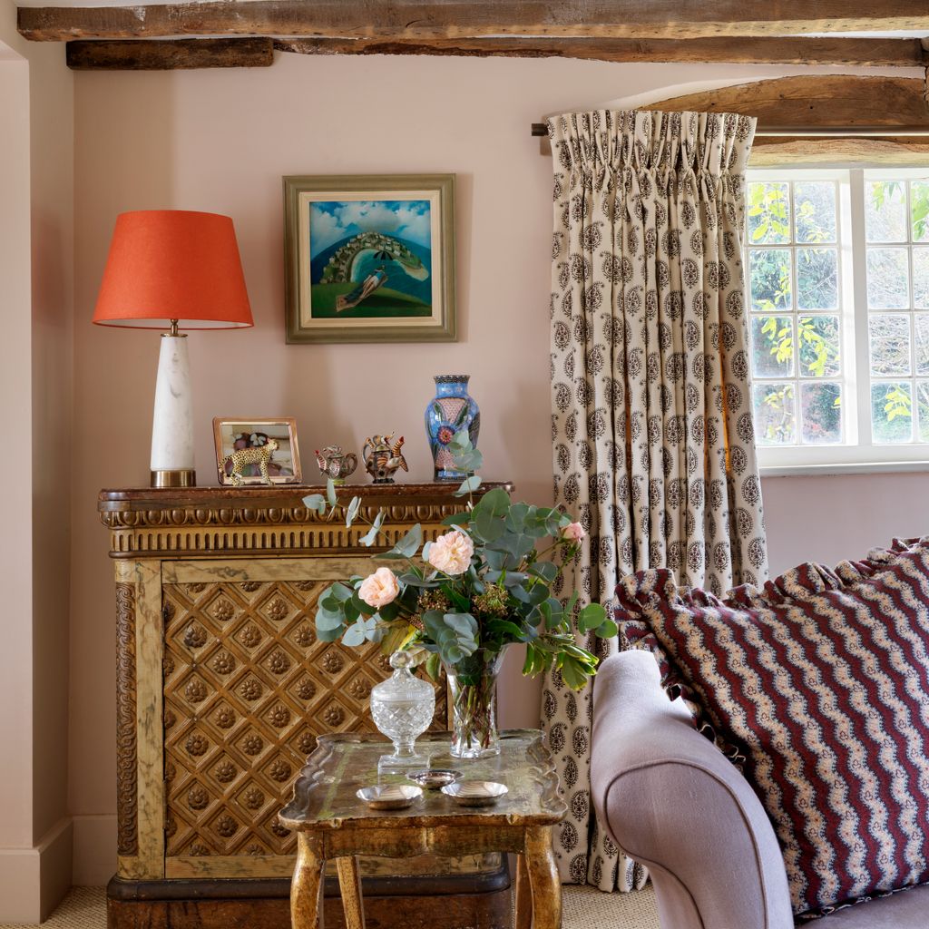 The sofa came from the Watlington auction house and Taline had it covered in grey linen from the Cloth Shop. The cushion...