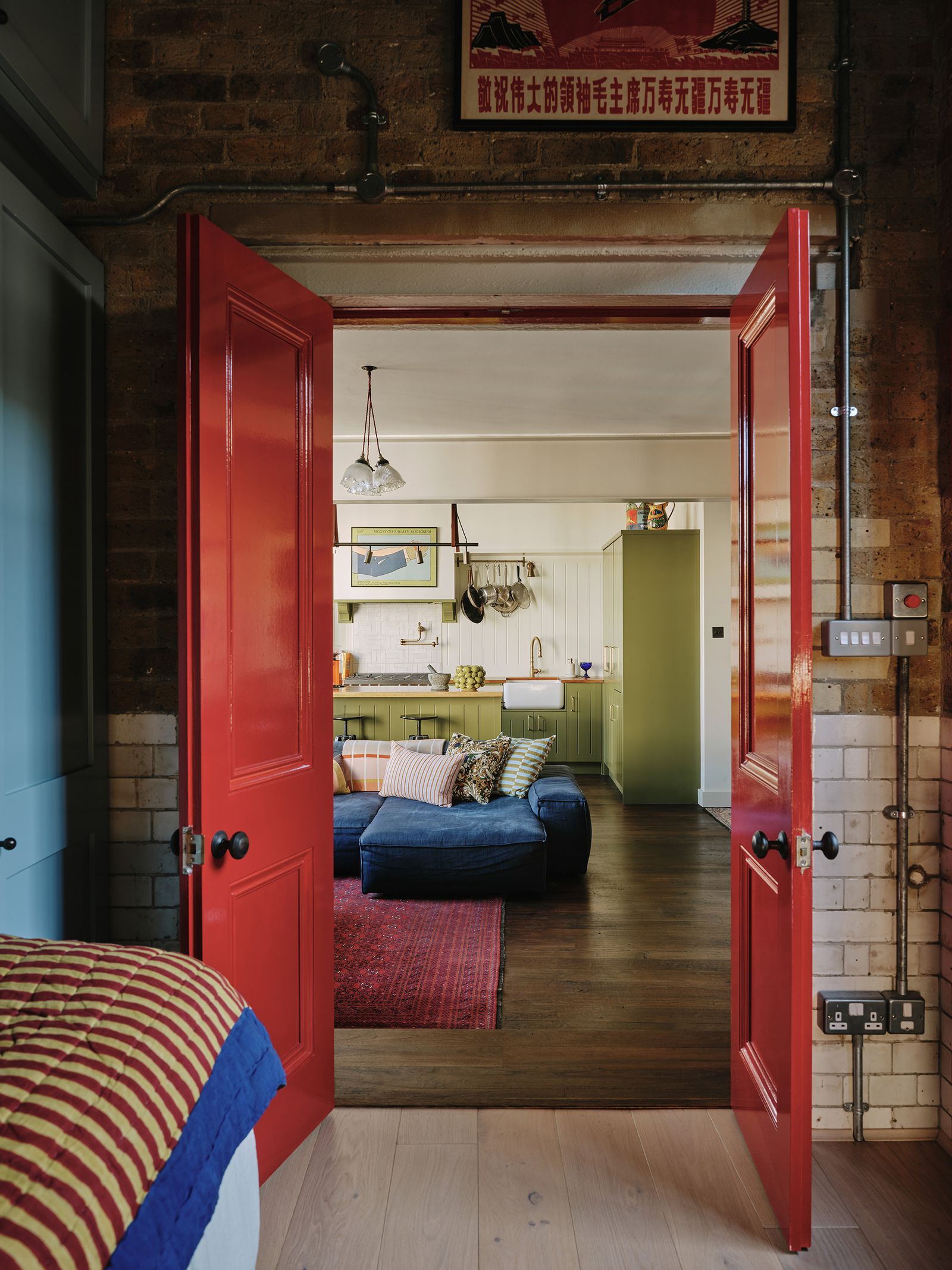 Image may contain Flooring Floor Wood Furniture Hardwood Cushion Pillow Living Room Room Indoors Bedroom and Door