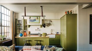 Image may contain Living Room Indoors Room Furniture Couch Cushion Interior Design Pillow and Shelf