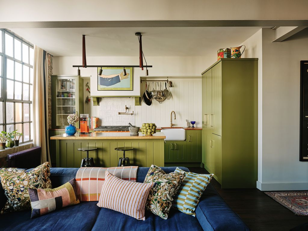 Image may contain Living Room Indoors Room Furniture Couch Cushion Interior Design Pillow and Shelf