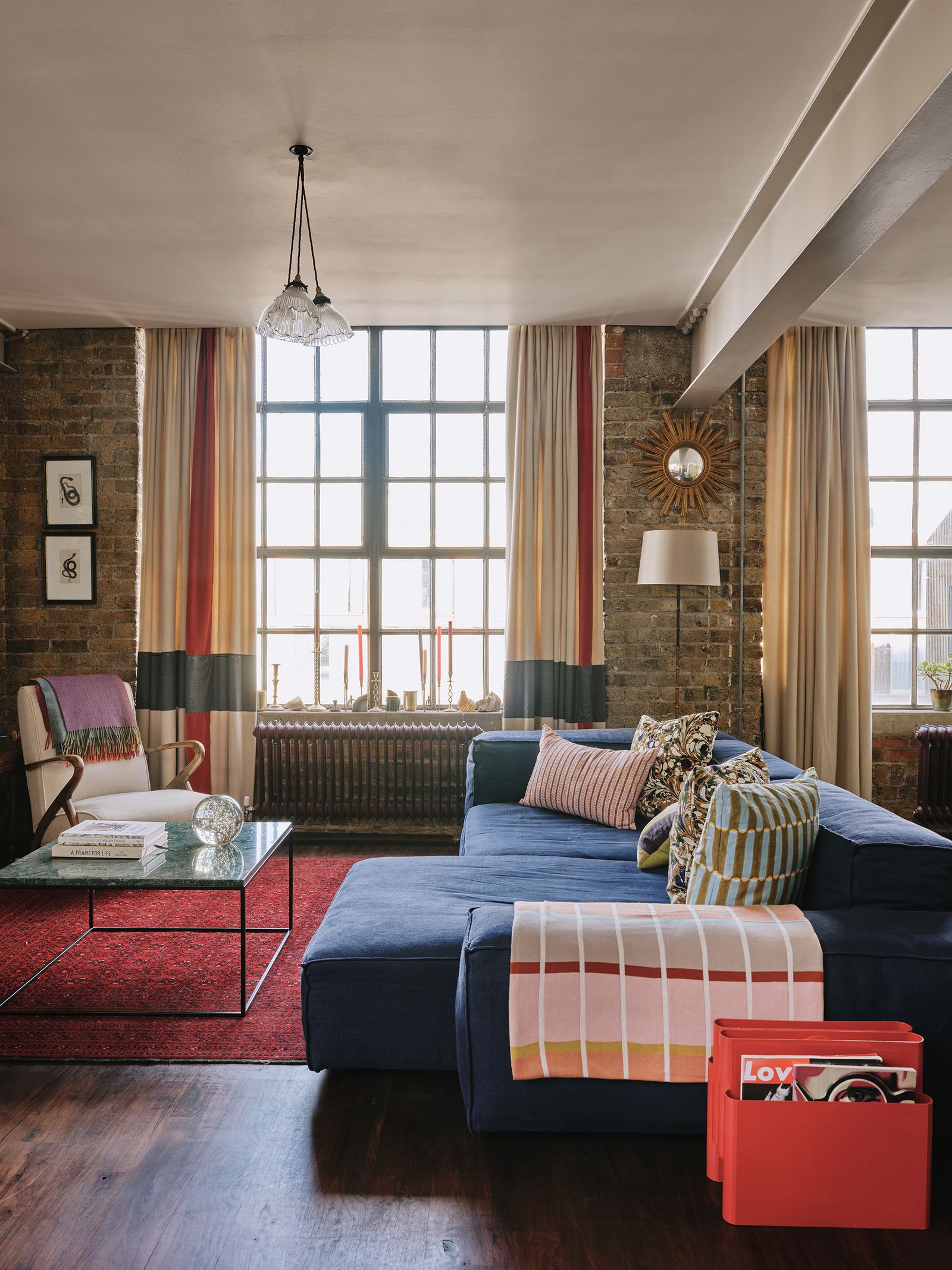 Image may contain Furniture Living Room Room Indoors Couch Table Interior Design Cushion and Coffee Table