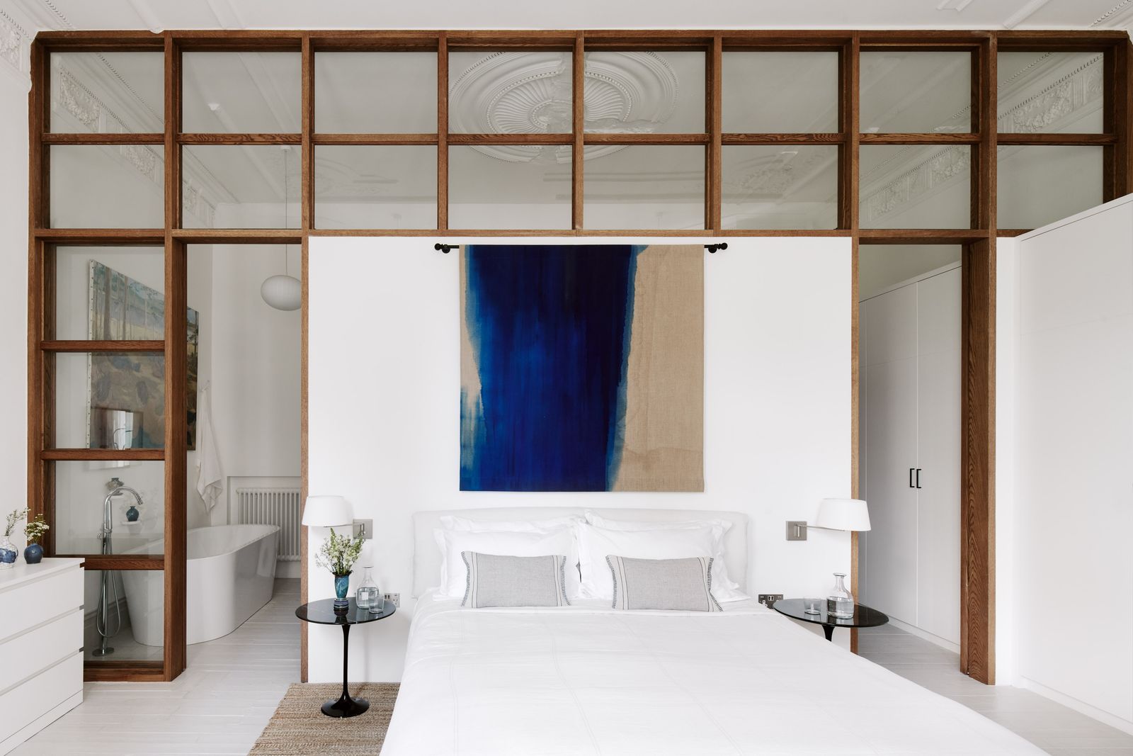 Image may contain Furniture Bed Indoors Room Bedroom Interior Design and Door