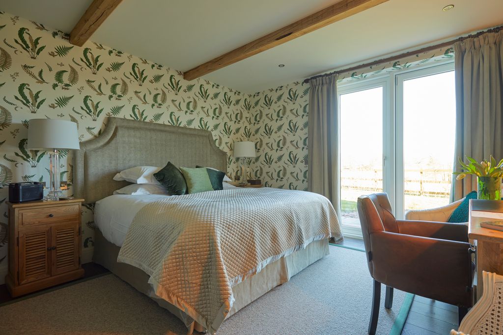 Image may contain Room Bedroom Indoors Furniture Bed Chair and Interior Design