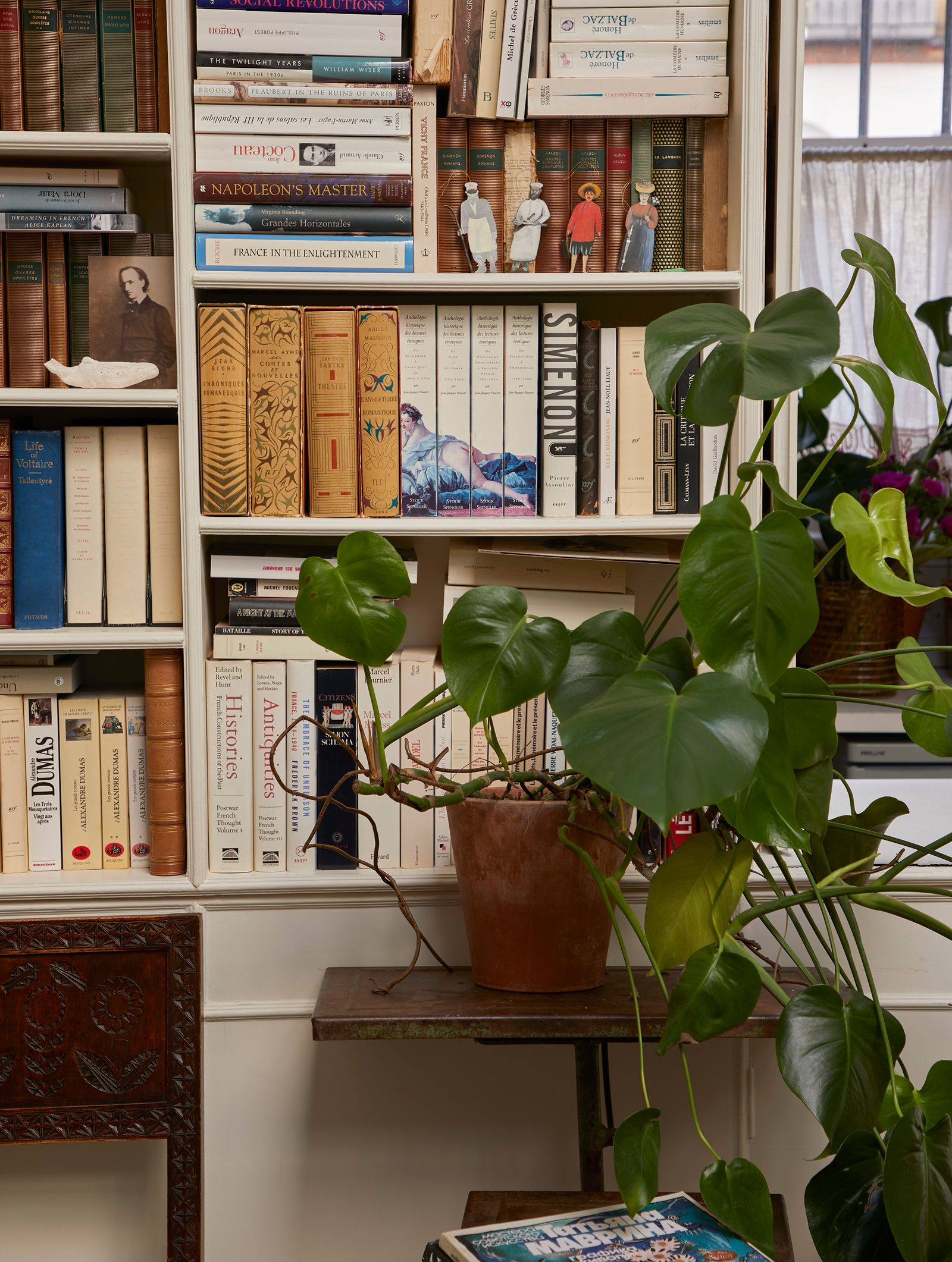 Image may contain Furniture Shelf Bookcase Human and Person