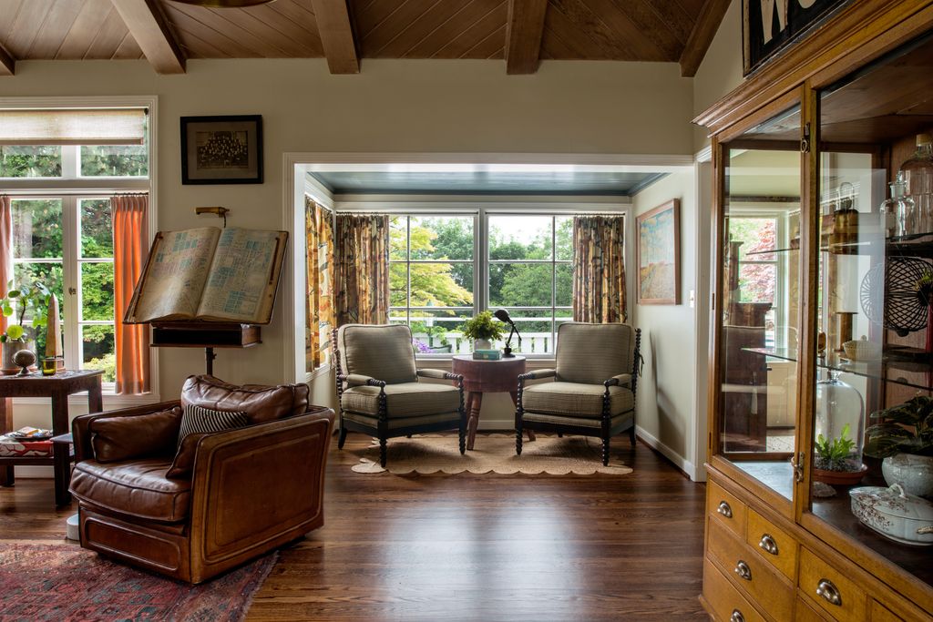 Image may contain Furniture Wood Hardwood Flooring Living Room Room Indoors Couch Interior Design Floor and Chair