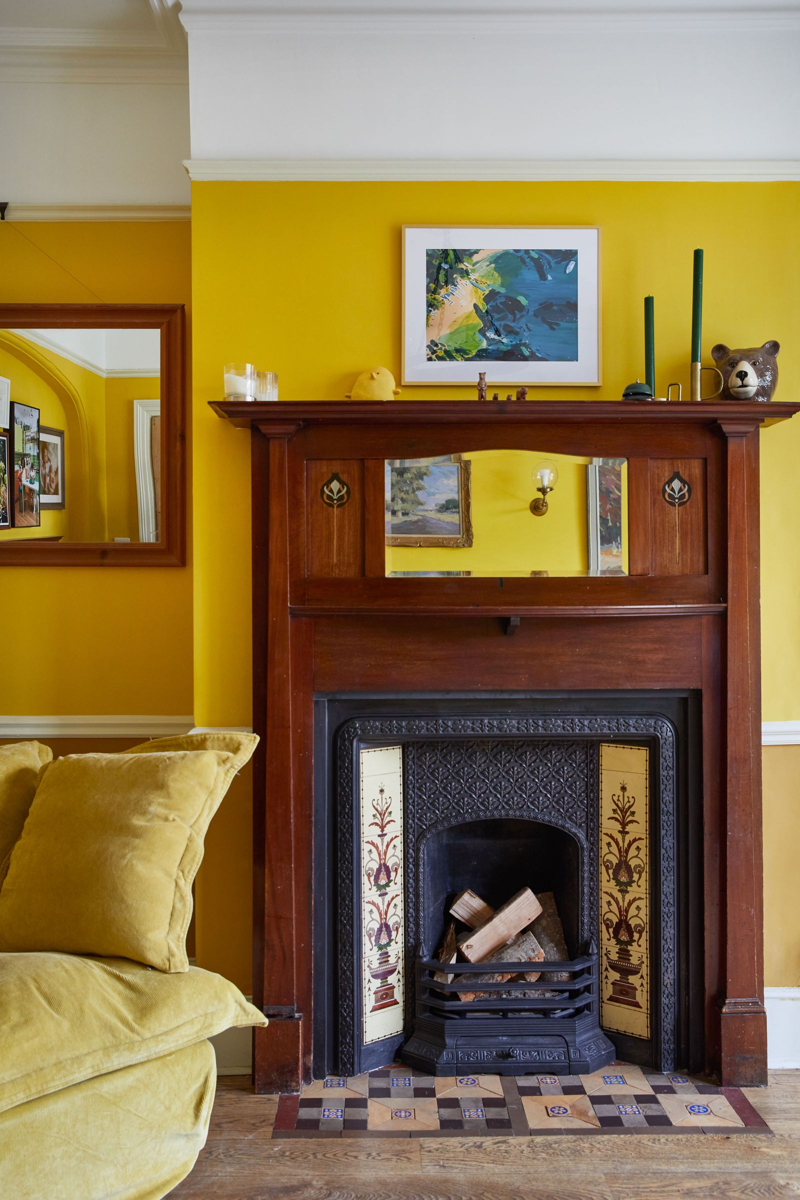 Image may contain Fireplace Indoors Furniture Living Room Room Couch Wood Cushion Hearth and Home Decor