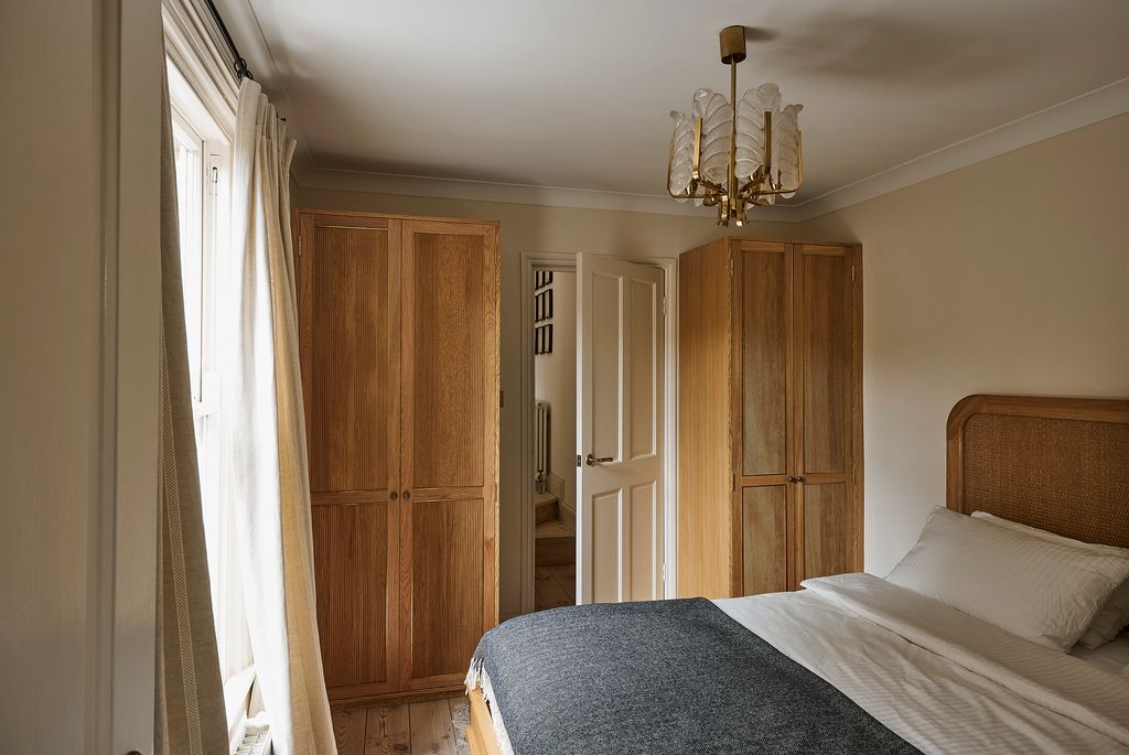 Image may contain Furniture Room Bedroom Indoors Bed Flooring and Wood