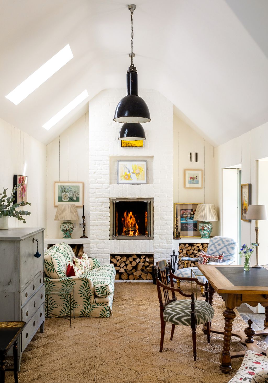 Image may contain Indoors Furniture Chair Interior Design Living Room Room Hearth Fireplace Housing and Building