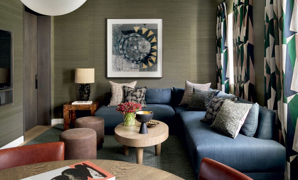 Image may contain Furniture Couch Living Room Indoors Room Table Coffee Table and Cushion