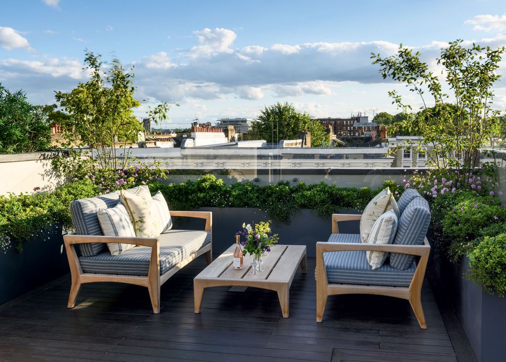 Image may contain Furniture Chair Terrace Table and Couch