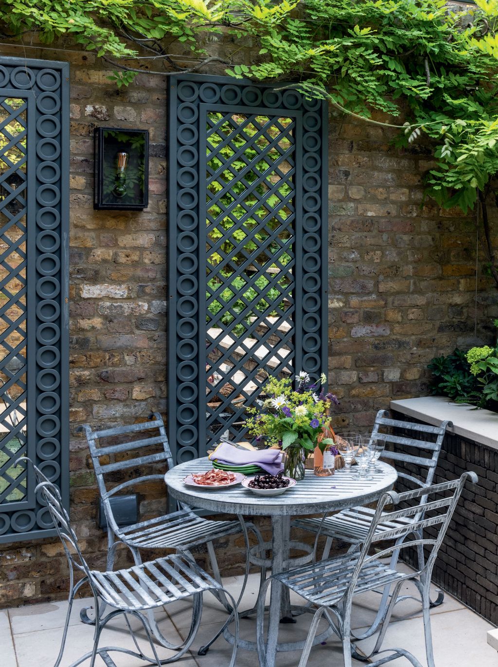 Image may contain Furniture Chair Plant Dining Table Table Flagstone Flower and Blossom