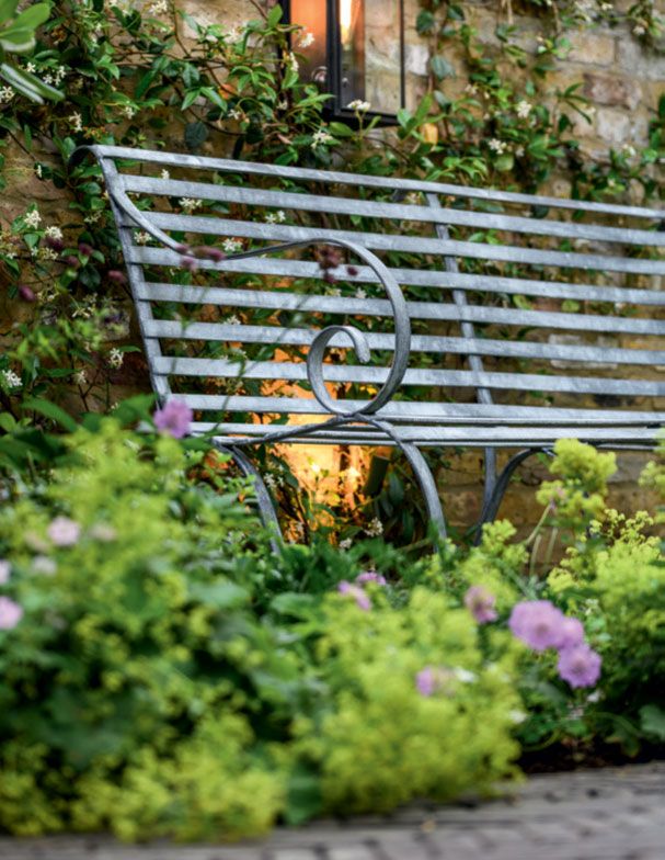 Image may contain Furniture Bench Park Bench Garden Outdoors and Arbour