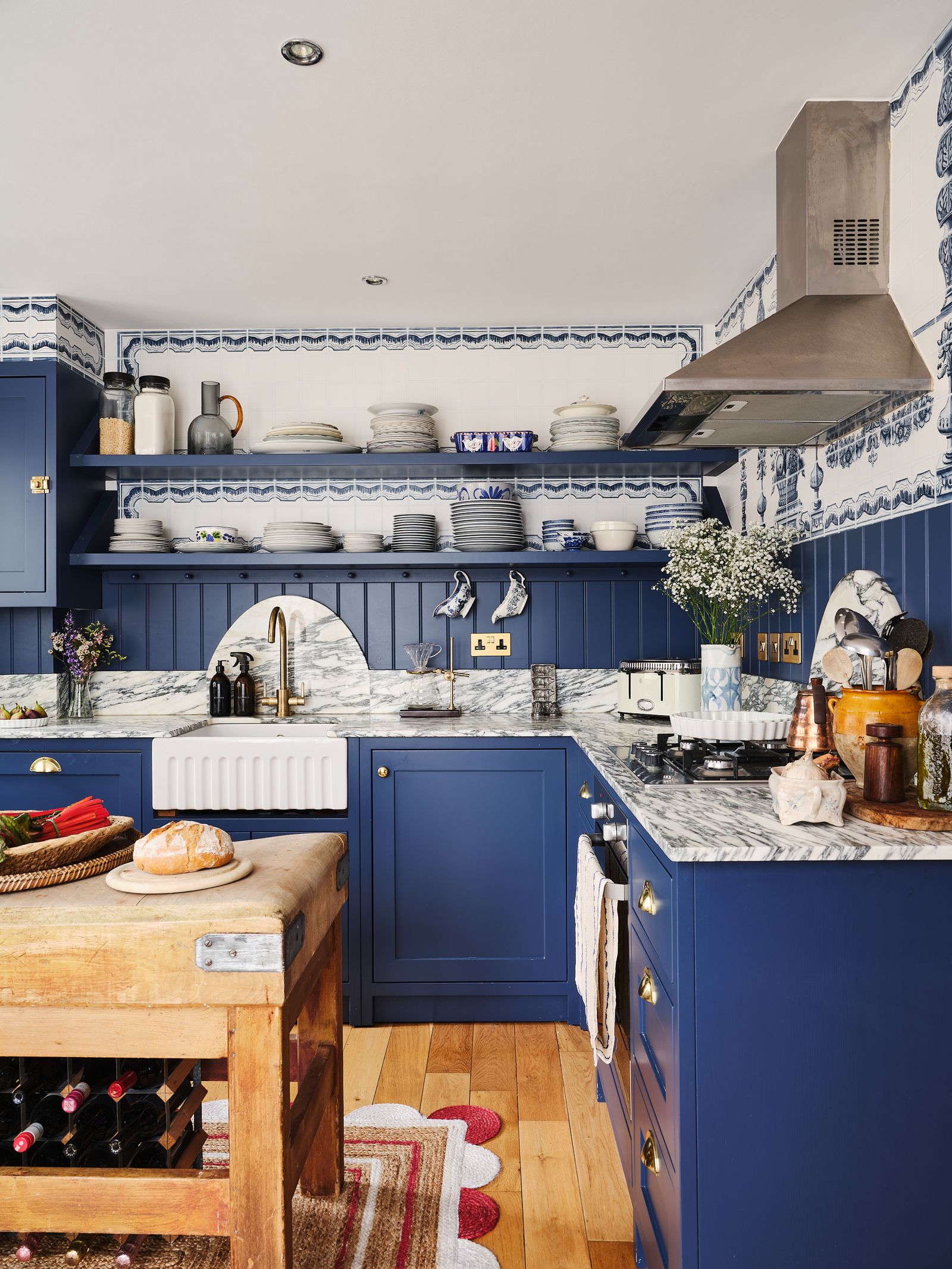 Image may contain Indoors Room Kitchen Interior Design and Kitchen Island