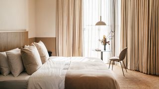 Image may contain Indoors Room Bedroom Furniture Chair Bed and Interior Design