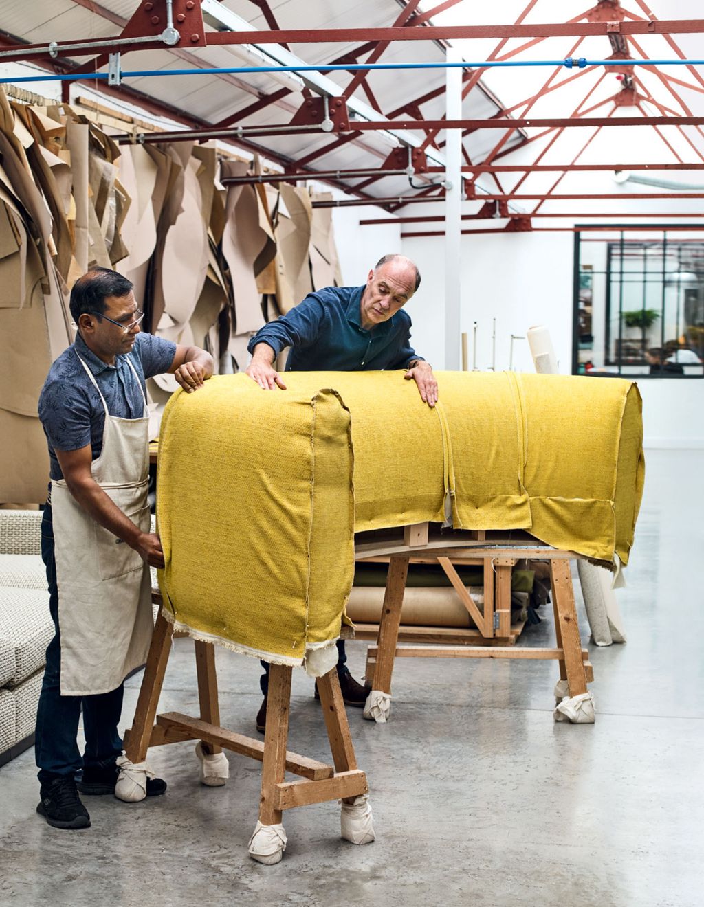 Image may contain Human Person Wood Plywood Footwear Clothing Shoe Apparel Furniture and Chair