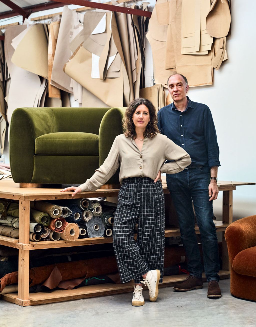 Image may contain Furniture Human Person Clothing Apparel Couch Shoe Footwear Table Living Room Indoors and Room