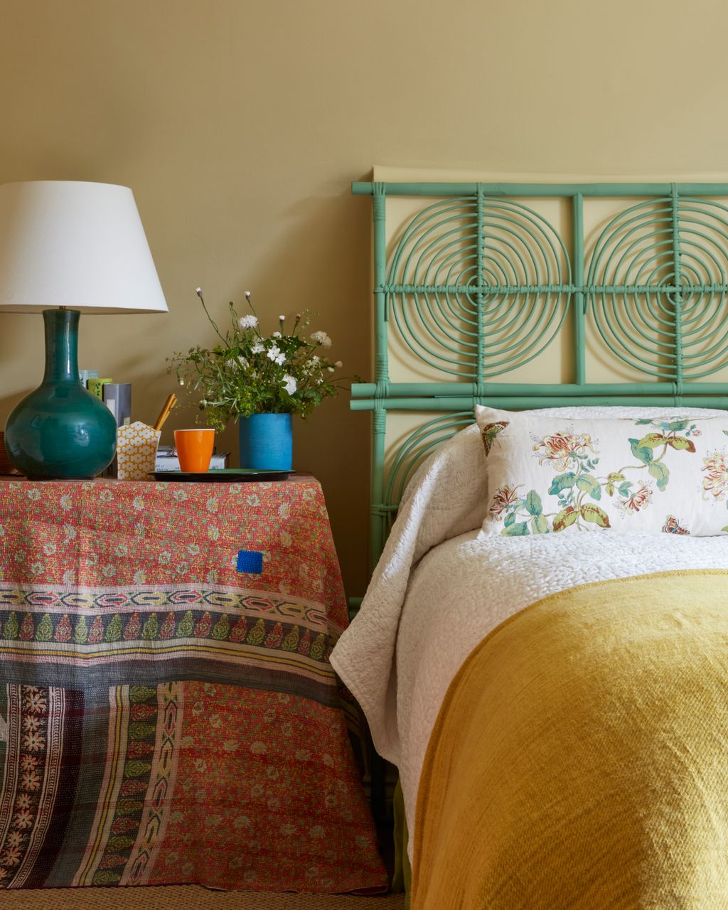 Image may contain Indoors Room Bedroom Lamp Table Lamp Cushion and Furniture