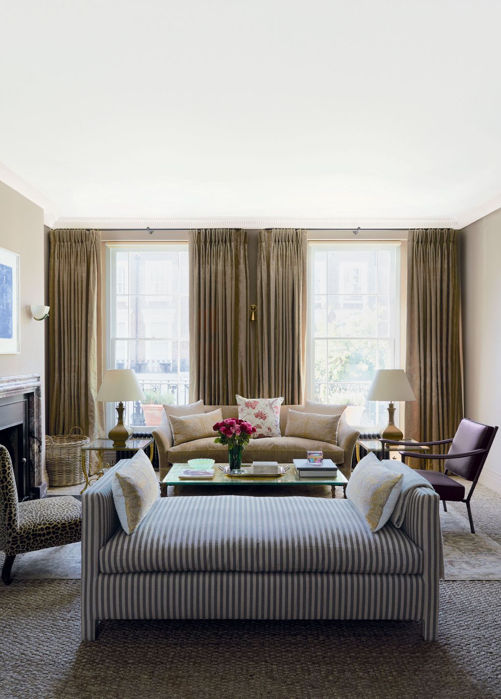 Image may contain Furniture Living Room Indoors Room Couch Chair and Rug