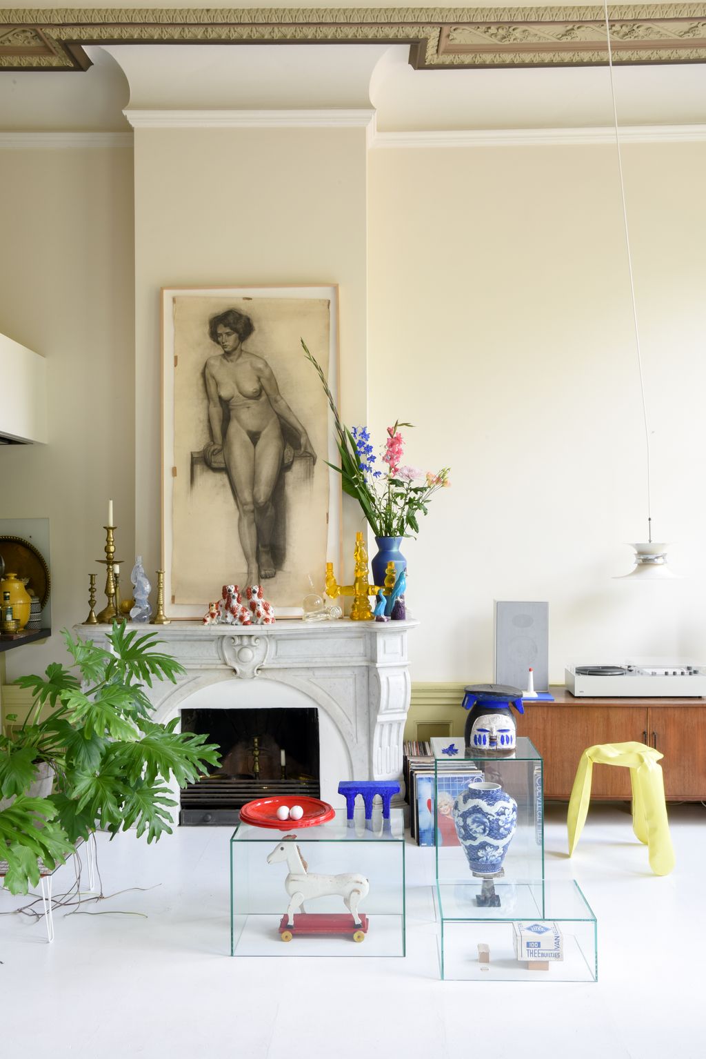 Image may contain Indoors Interior Design Plant Human Person Flower Blossom Vase Pottery and Jar