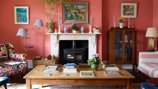 Image may contain Living Room Room Indoors Furniture Interior Design Table Wood Couch Fireplace and Hardwood