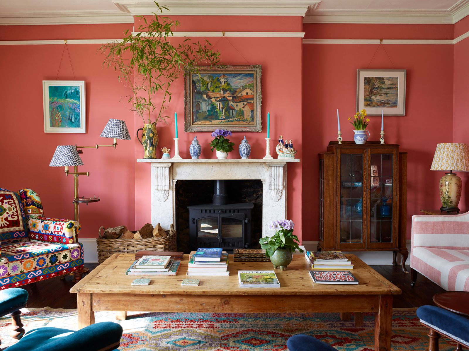 Image may contain Living Room Room Indoors Furniture Interior Design Table Wood Couch Fireplace and Hardwood