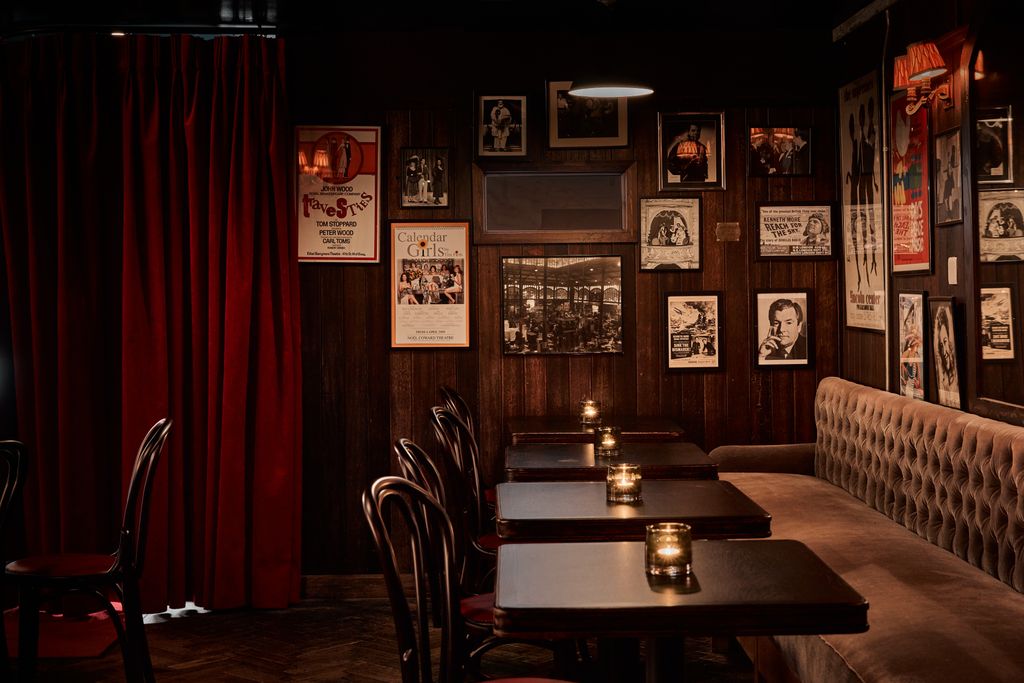 Image may contain Restaurant Kenneth More Cafe Furniture Chair and Cafeteria