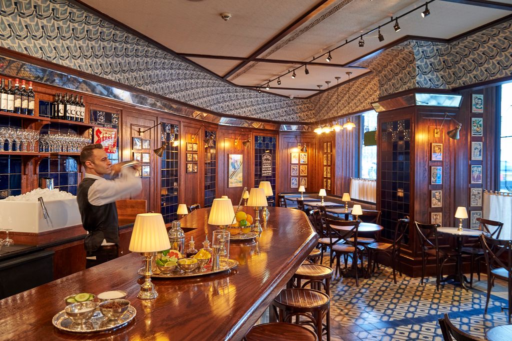 Image may contain Human Person Restaurant Furniture Chair Food Meal Cafeteria Pub Cafe and Bar Counter