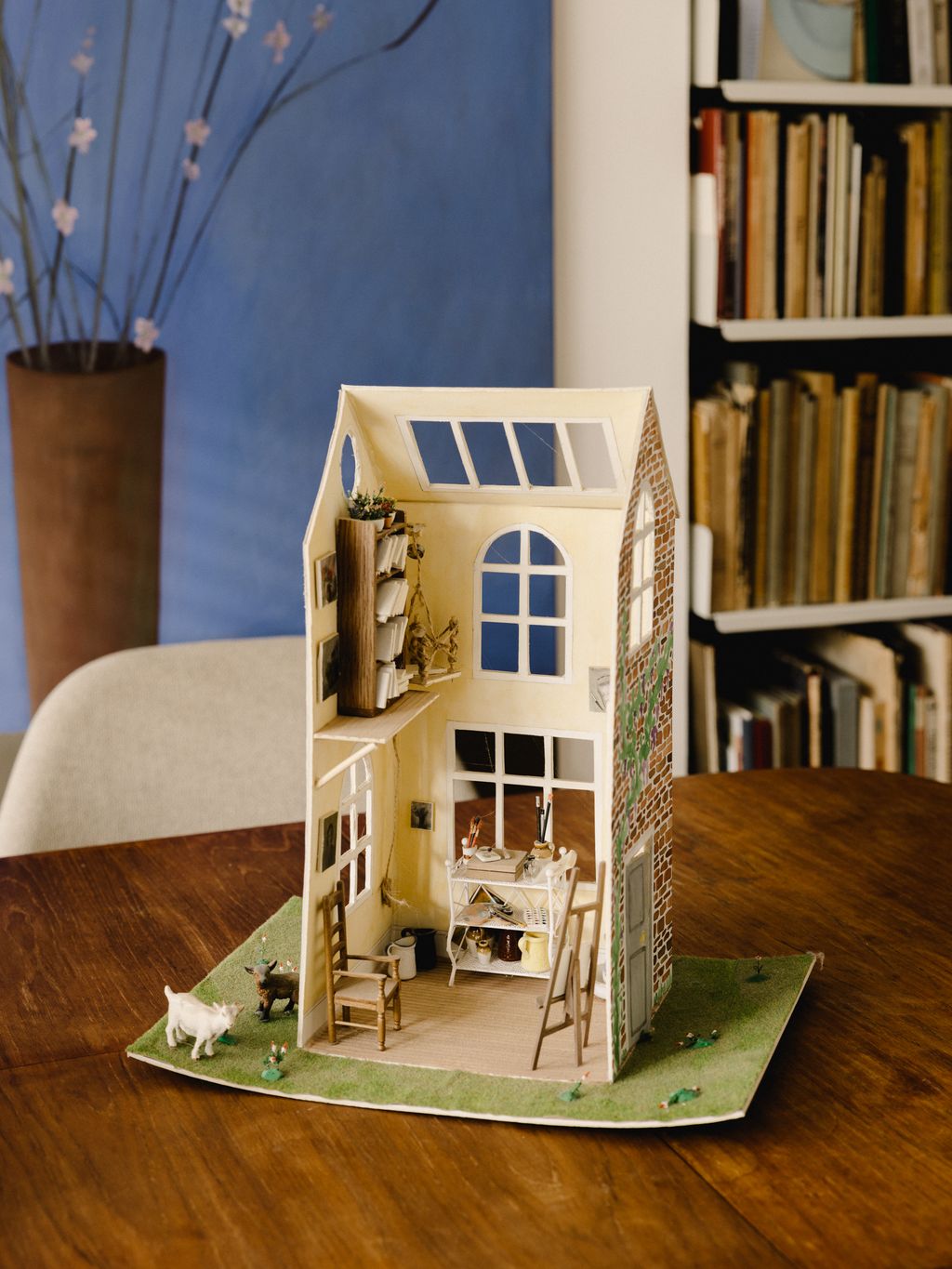 Image may contain Furniture Wood Bookcase Shelf Hardwood Interior Design Indoors Plywood and Room